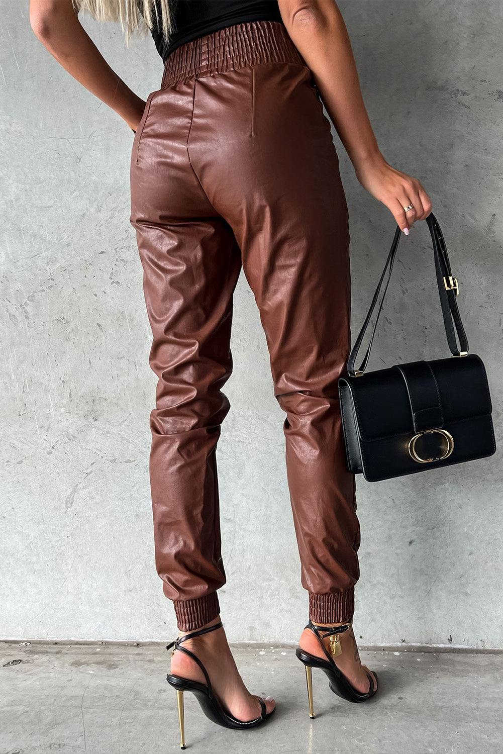 Black Smocked High-Waist Leather Skinny Pants


		The casual joggers accentuate your curves and flatter your silhouette
	
	
		Crafted from high-quality faux leather for a sleek and stylish look
	
	
		SmBottomsDalilly Designs BoutiqueBlack Smocked High-Waist Leather Skinny Pants