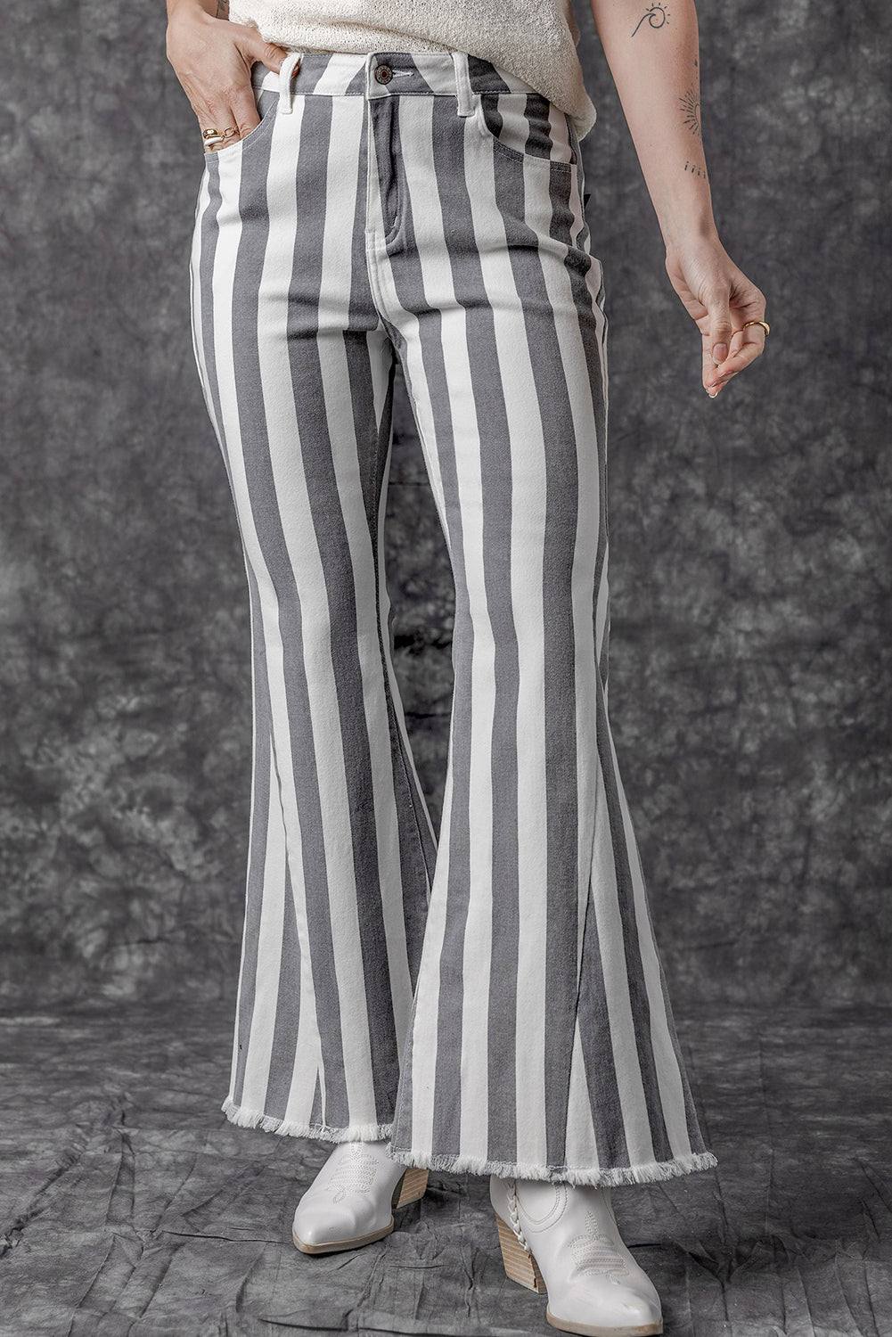 Stripe Star Embellished Western Flare Jeans

	


		These stylish flared jeans are versatile and eye-catching
	
	
		The high waistline makes your legs look longer
	
	
		The vertical stripe print creaBottomsDalilly Designs BoutiqueStripe Star Embellished Western Flare Jeans