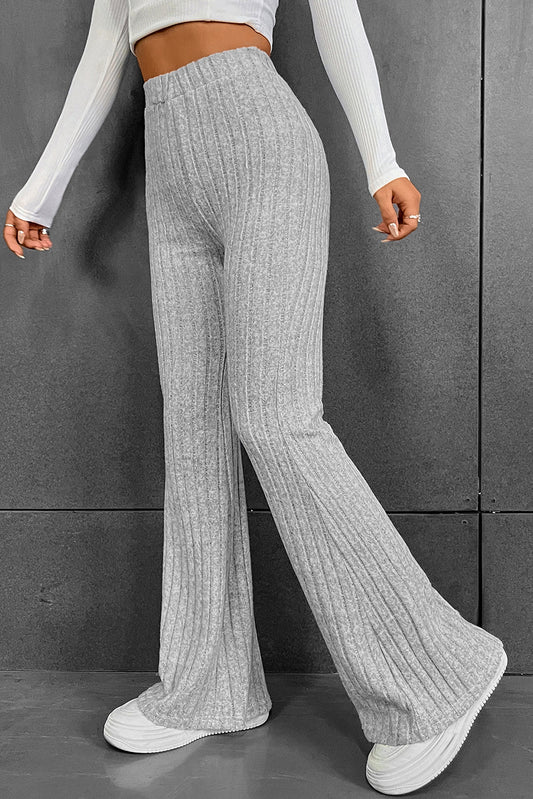 Gray Solid Color High Waist Ribbed Flare Pants

The solid color pants are easy to pair with other items in your wardrobe
	The high waist design offers both style and comfort with a flattering fit
	With a flaredBottomsDalilly Designs BoutiqueGray Solid Color High Waist Ribbed Flare Pants