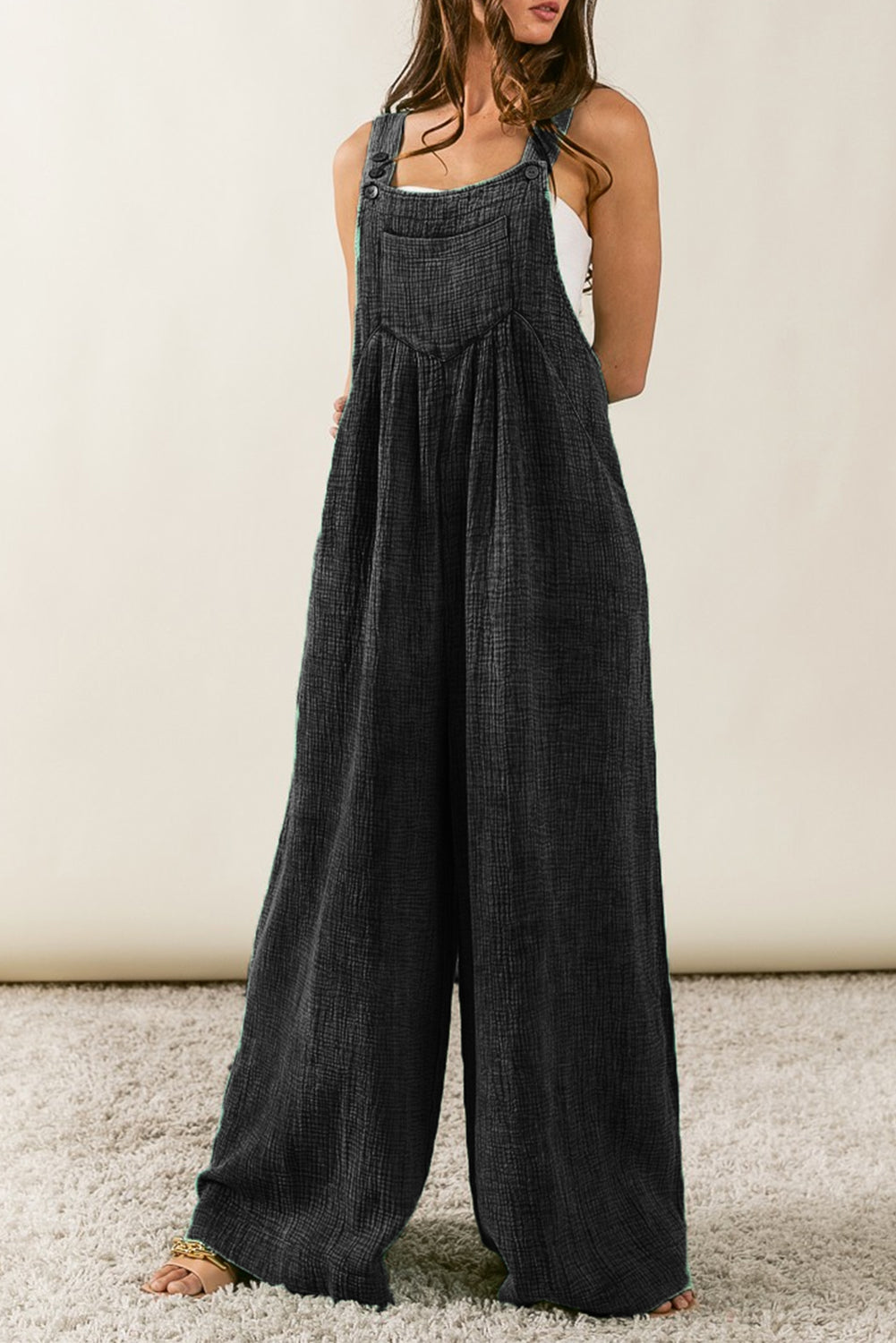 Black Textured Wide Leg Overalls

	Make a statement in these fashion-forward overalls
	Featuring a textured fabric and wide leg silhouette, you'll be comfy all day
	The side and chest pockets desiBottomsDalilly Designs BoutiqueBlack Textured Wide Leg Overalls