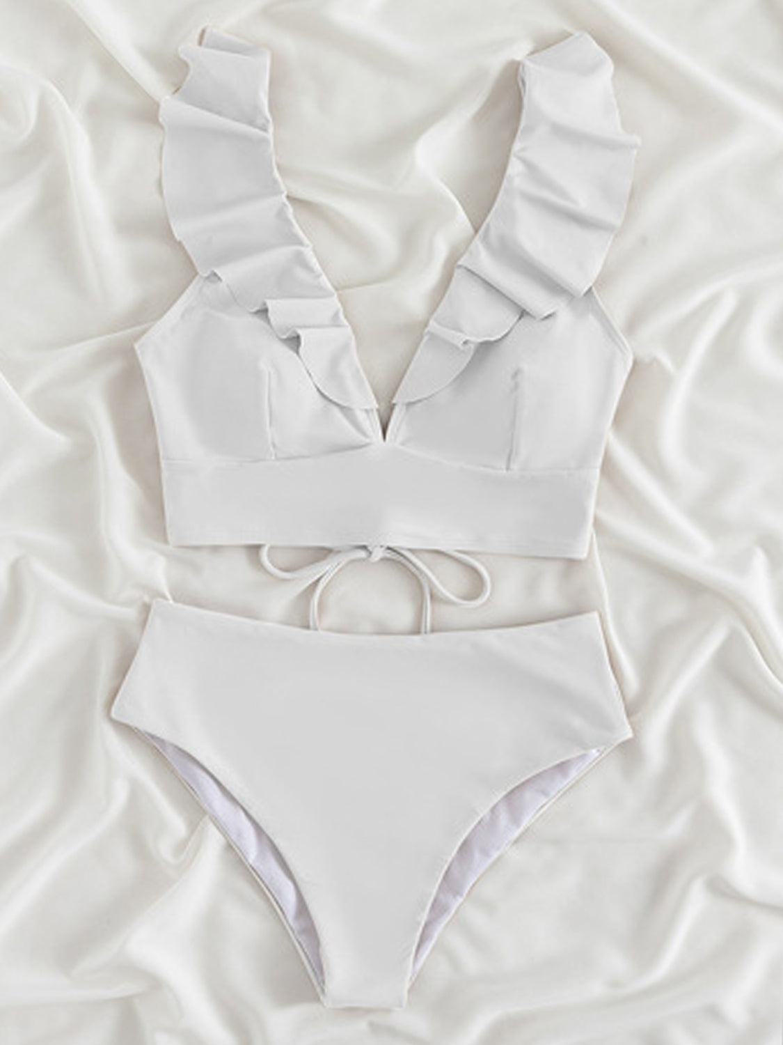 Ruffled V-Neck Sleeveless Two-Piece Swim Set
Features: Ruffled
Number of pieces: Two-piece
Chest pad: Removable padding
Underwire: No underwire
Stretch: Moderate stretch
Material composition: 80% polyamide, 200Dalilly Designs Boutique-Piece Swim Set