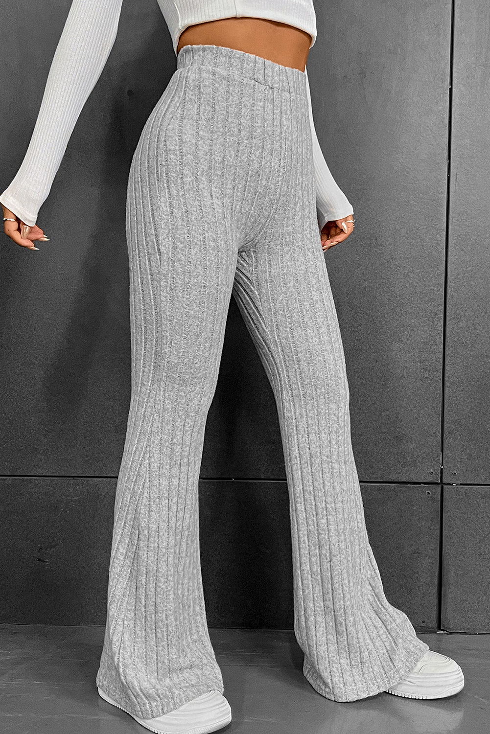 Gray Solid Color High Waist Ribbed Flare Pants

The solid color pants are easy to pair with other items in your wardrobe
	The high waist design offers both style and comfort with a flattering fit
	With a flaredBottomsDalilly Designs BoutiqueGray Solid Color High Waist Ribbed Flare Pants