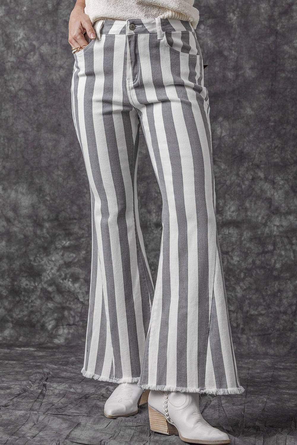 Stripe Star Embellished Western Flare Jeans

	


		These stylish flared jeans are versatile and eye-catching
	
	
		The high waistline makes your legs look longer
	
	
		The vertical stripe print creaBottomsDalilly Designs BoutiqueStripe Star Embellished Western Flare Jeans