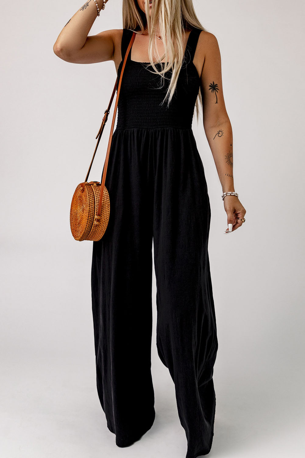 Black Smocked Sleeveless Wide Leg Jumpsuit with Pockets


		This shirred jumpsuit fits most body shapes with elasticity
	
	
		Featured with a square neckline, sleeveless, ruched waist, wide leg, and side pocket
	
BottomsDalilly Designs BoutiqueBlack Smocked Sleeveless Wide Leg Jumpsuit