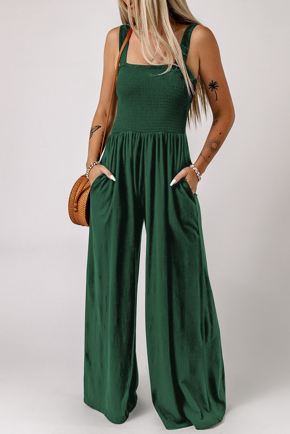 Black Smocked Sleeveless Wide Leg Jumpsuit with Pockets


		This shirred jumpsuit fits most body shapes with elasticity
	
	
		Featured with a square neckline, sleeveless, ruched waist, wide leg, and side pocket
	
BottomsDalilly Designs BoutiqueBlack Smocked Sleeveless Wide Leg Jumpsuit