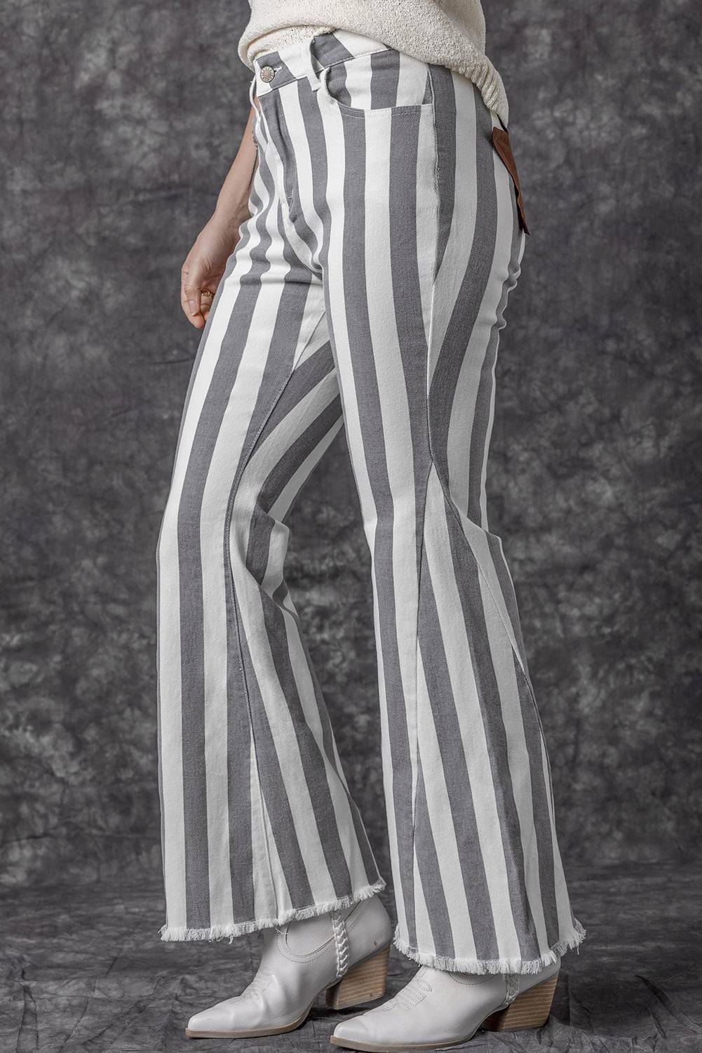 Stripe Star Embellished Western Flare Jeans

	


		These stylish flared jeans are versatile and eye-catching
	
	
		The high waistline makes your legs look longer
	
	
		The vertical stripe print creaBottomsDalilly Designs BoutiqueStripe Star Embellished Western Flare Jeans