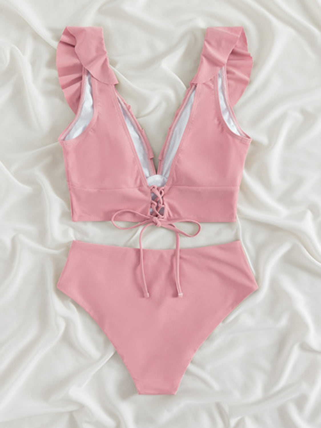 Ruffled V-Neck Sleeveless Two-Piece Swim Set
Features: Ruffled
Number of pieces: Two-piece
Chest pad: Removable padding
Underwire: No underwire
Stretch: Moderate stretch
Material composition: 80% polyamide, 200Dalilly Designs Boutique-Piece Swim Set