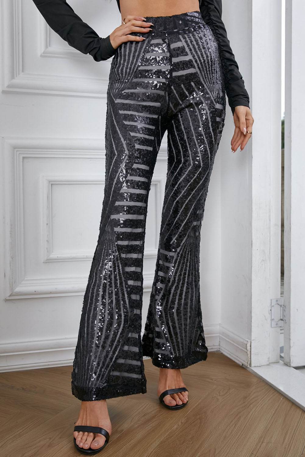 Black Sequin Wide Leg Pants

Insanely gorgeous sequins on mesh in an Art Deco pattern
Super flattering cut giving you legs for days fitting snugly to the knee with a wide flare
Stunning sequiBottomsDalilly Designs BoutiqueBlack Sequin Wide Leg Pants