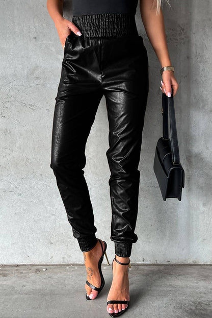 Black Smocked High-Waist Leather Skinny Pants


		The casual joggers accentuate your curves and flatter your silhouette
	
	
		Crafted from high-quality faux leather for a sleek and stylish look
	
	
		SmBottomsDalilly Designs BoutiqueBlack Smocked High-Waist Leather Skinny Pants