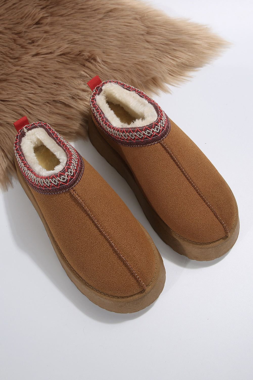 Chestnut Suede Contrast Print Plush Lined Snow Boots


		Step into comfort and style with its round-toe design and slip-on style
	
	
		Keep your feet warm during winter with the thermal plush-lined design
	
	
Shoes & BagsDalilly Designs BoutiqueChestnut Suede Contrast Print Plush Lined Snow Boots