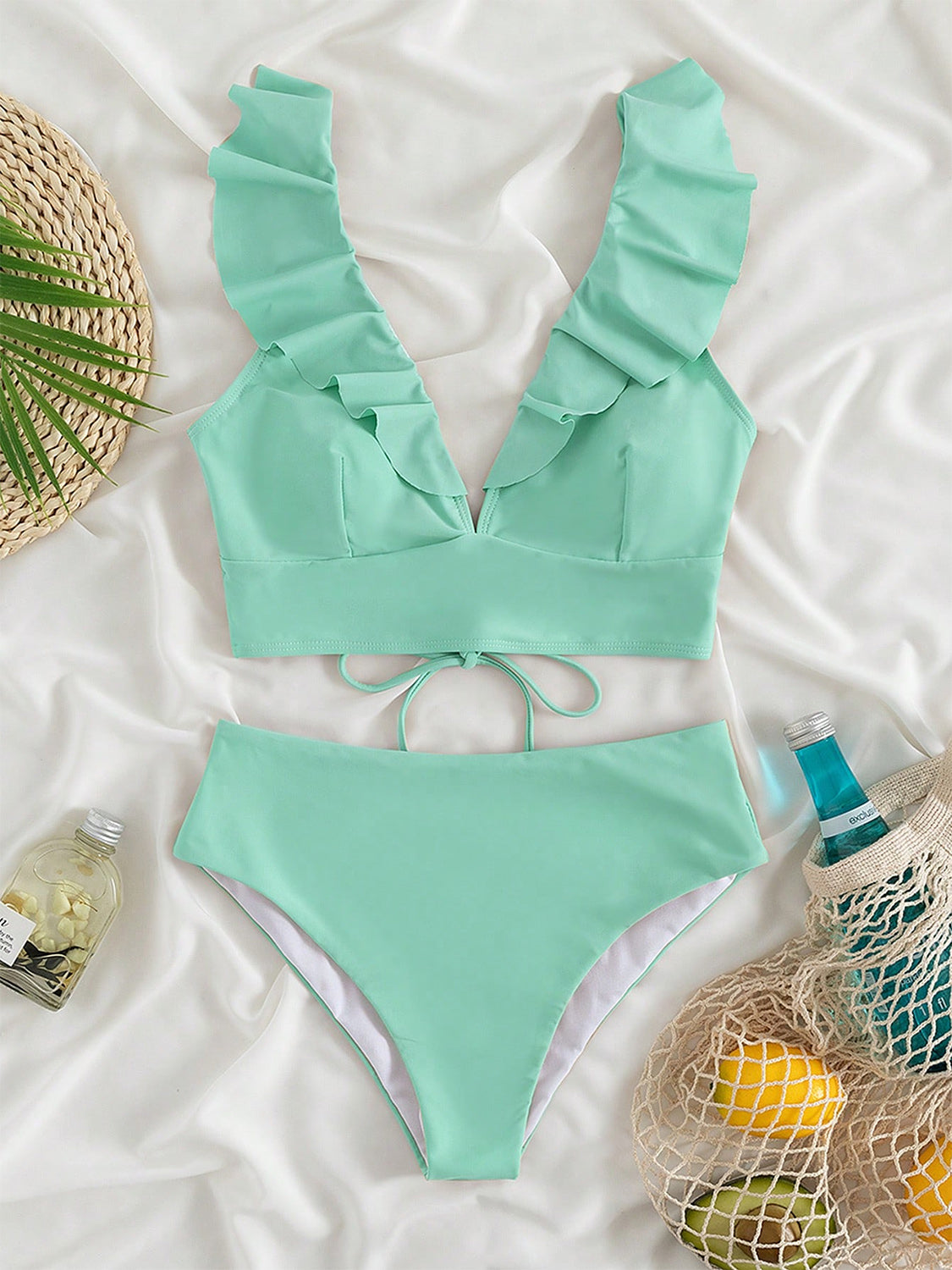 Ruffled V-Neck Sleeveless Two-Piece Swim Set
Features: Ruffled
Number of pieces: Two-piece
Chest pad: Removable padding
Underwire: No underwire
Stretch: Moderate stretch
Material composition: 80% polyamide, 200Dalilly Designs Boutique-Piece Swim Set