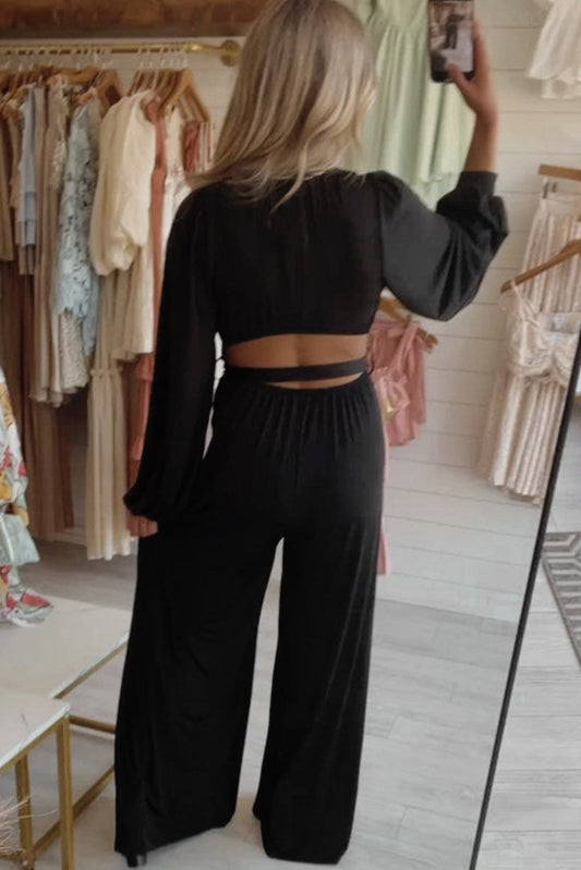 Black Cutout Back Belted V Neck Wide Leg Jumpsuit


		This high waist jumpsuit is perfect for both formal occasions and casual outings
	
	
		The wide leg design creates a flowing and elegant silhouette
	
	
BottomsDalilly Designs BoutiqueBlack Cutout Back Belted