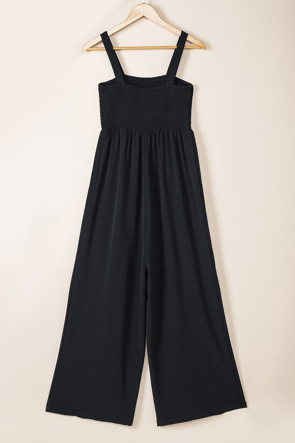 Black Smocked Sleeveless Wide Leg Jumpsuit with Pockets


		This shirred jumpsuit fits most body shapes with elasticity
	
	
		Featured with a square neckline, sleeveless, ruched waist, wide leg, and side pocket
	
BottomsDalilly Designs BoutiqueBlack Smocked Sleeveless Wide Leg Jumpsuit