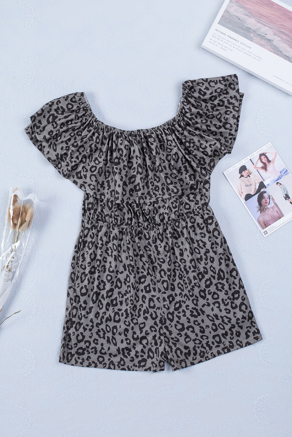 Leopard Off-Shoulder Romper with Pockets


		This ladies’ romper is classic and wild with animal print all over
	
	
		Off-shoulder design with elastic neckline, overlay bust, tunic waist and shorts boBottomsDalilly Designs Boutique-Shoulder Romper