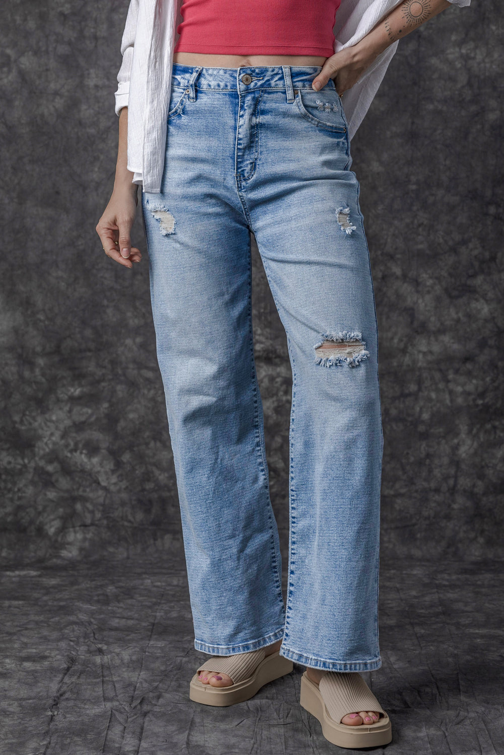 Light Blue High Rise Distressed Straight Leg Jeans

	


		Distressed detailing adds a trendy edge to these high rise jeans
	
	
		The straight leg silhouette creates a flattering and versatile fit, suitable foBottomsDalilly Designs BoutiqueLight Blue High Rise Distressed Straight Leg Jeans