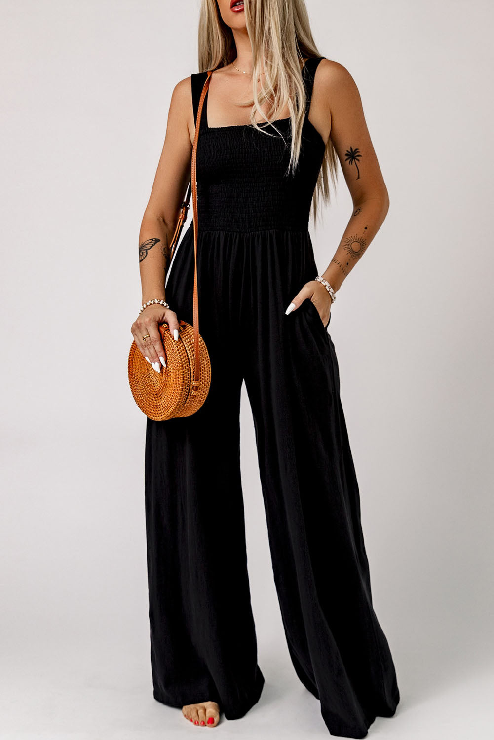 Black Smocked Sleeveless Wide Leg Jumpsuit with Pockets


		This shirred jumpsuit fits most body shapes with elasticity
	
	
		Featured with a square neckline, sleeveless, ruched waist, wide leg, and side pocket
	
BottomsDalilly Designs BoutiqueBlack Smocked Sleeveless Wide Leg Jumpsuit