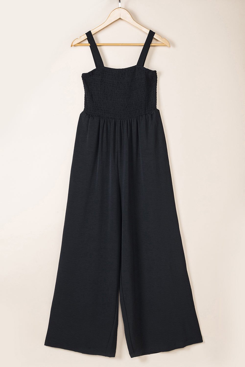 Black Smocked Sleeveless Wide Leg Jumpsuit with Pockets


		This shirred jumpsuit fits most body shapes with elasticity
	
	
		Featured with a square neckline, sleeveless, ruched waist, wide leg, and side pocket
	
BottomsDalilly Designs BoutiqueBlack Smocked Sleeveless Wide Leg Jumpsuit