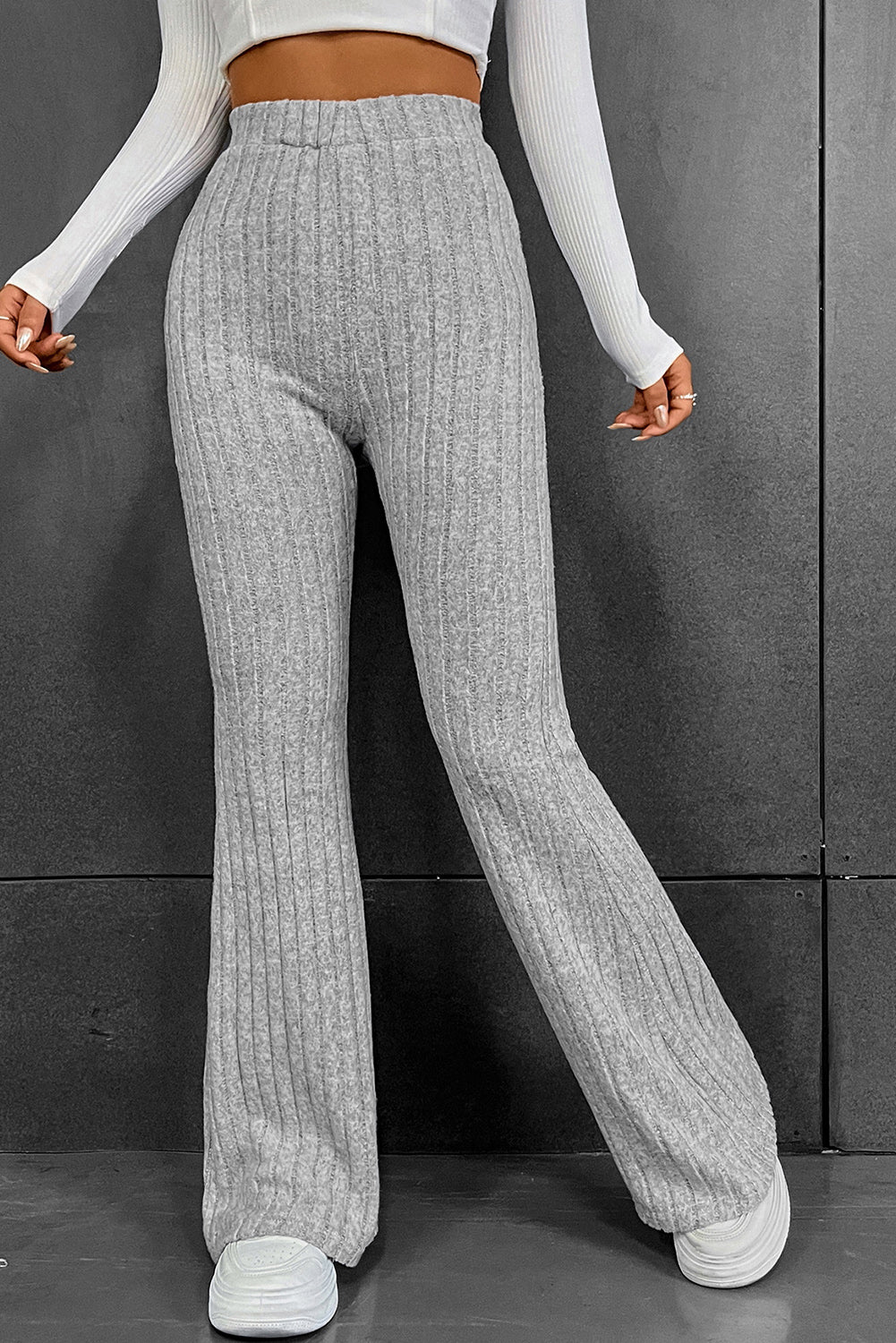 Gray Solid Color High Waist Ribbed Flare Pants

The solid color pants are easy to pair with other items in your wardrobe
	The high waist design offers both style and comfort with a flattering fit
	With a flaredBottomsDalilly Designs BoutiqueGray Solid Color High Waist Ribbed Flare Pants