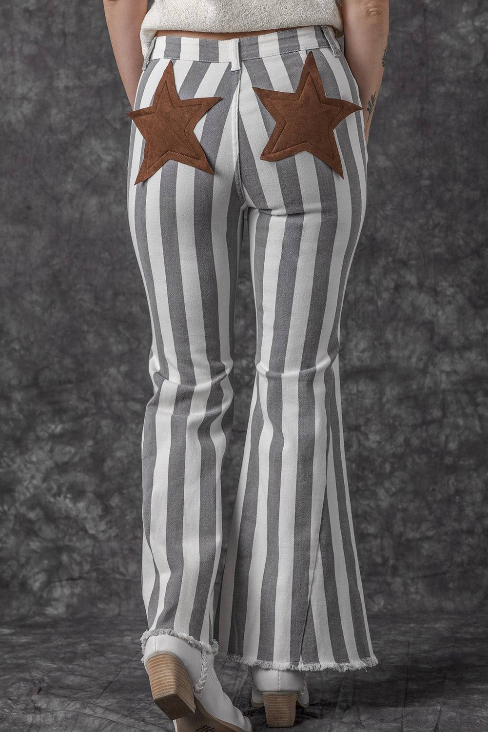 Stripe Star Embellished Western Flare Jeans

	


		These stylish flared jeans are versatile and eye-catching
	
	
		The high waistline makes your legs look longer
	
	
		The vertical stripe print creaBottomsDalilly Designs BoutiqueStripe Star Embellished Western Flare Jeans