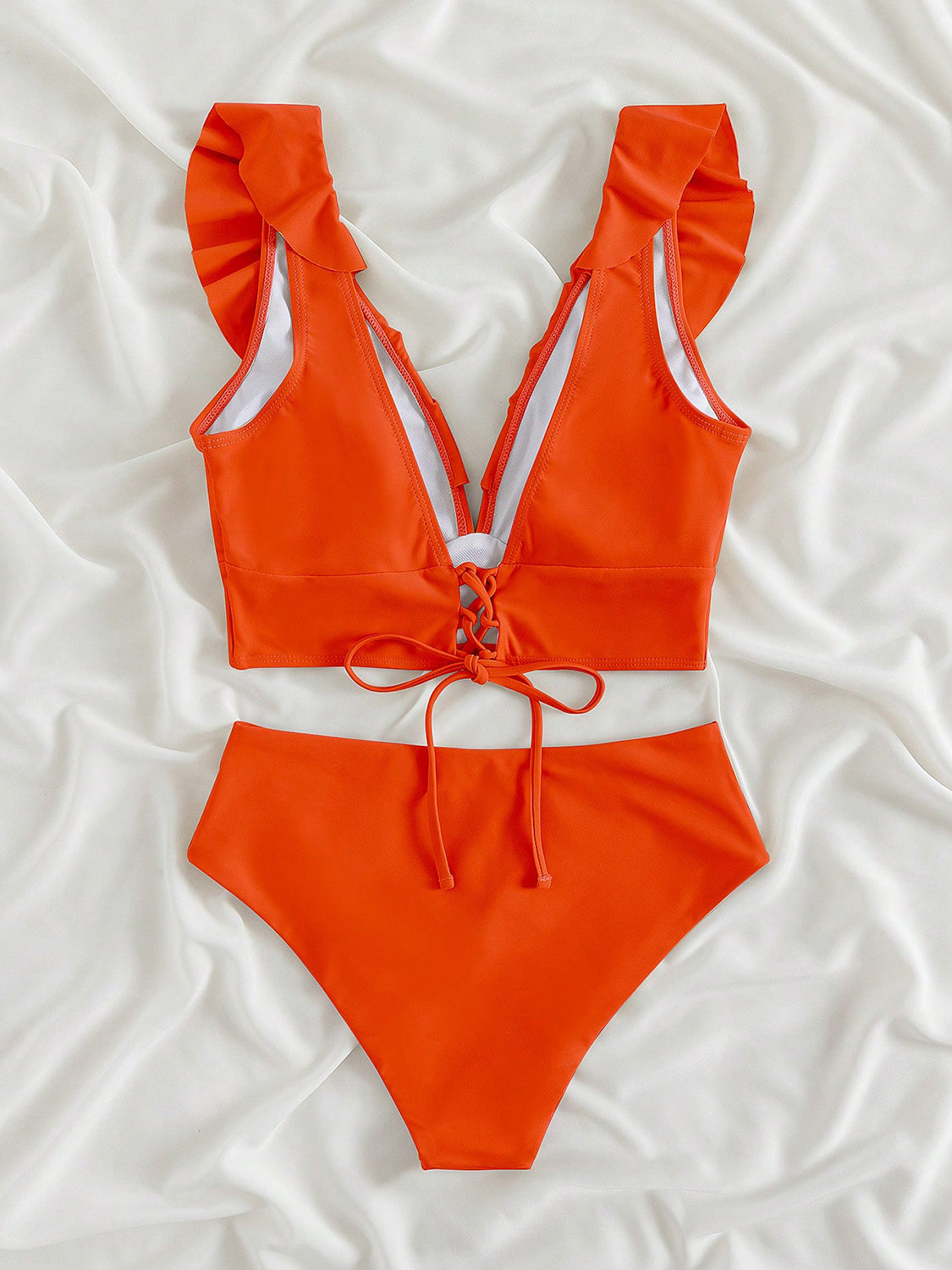 Ruffled V-Neck Sleeveless Two-Piece Swim Set
Features: Ruffled
Number of pieces: Two-piece
Chest pad: Removable padding
Underwire: No underwire
Stretch: Moderate stretch
Material composition: 80% polyamide, 200Dalilly Designs Boutique-Piece Swim Set