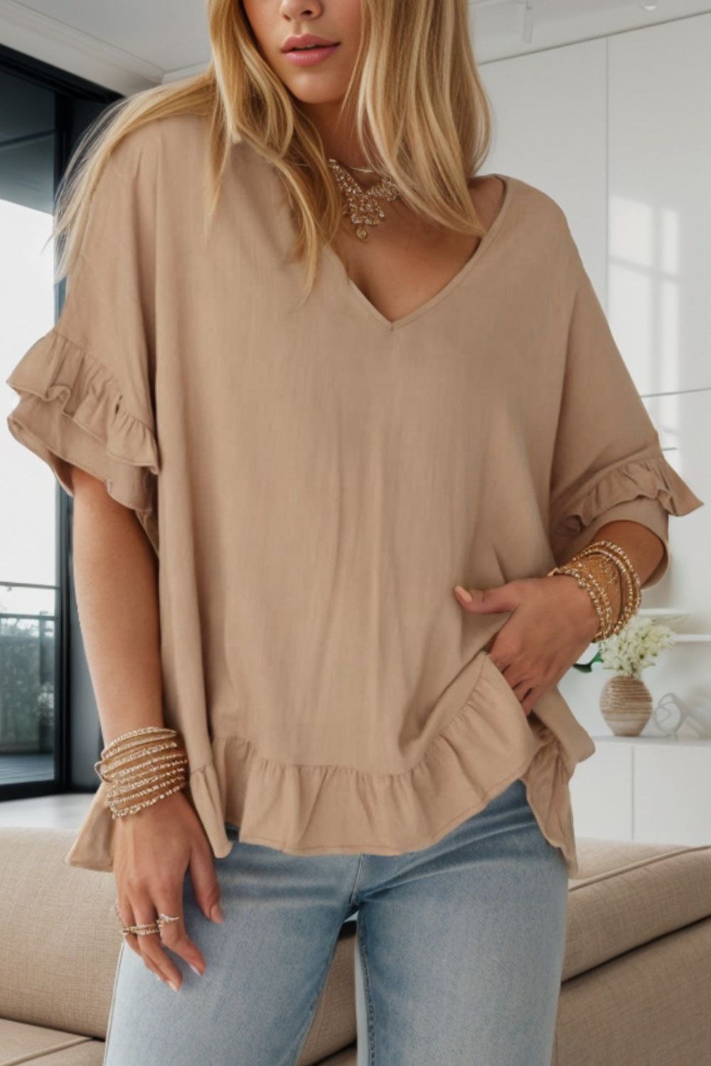 Ruffled V-Neck Half Sleeve Blouse
Features: Ruffled
Sheer: Opaque
Stretch: No stretch
Material composition: 58% viscose, 37% polyester, 5% polyamide
Care instructions: Machine wash cold. Tumble dry TopsDalilly Designs Boutique-Neck Half Sleeve Blouse