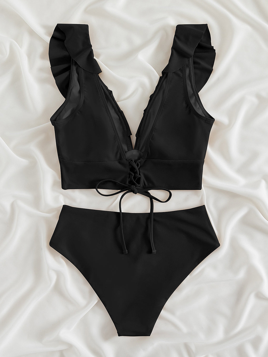 Ruffled V-Neck Sleeveless Two-Piece Swim Set
Features: Ruffled
Number of pieces: Two-piece
Chest pad: Removable padding
Underwire: No underwire
Stretch: Moderate stretch
Material composition: 80% polyamide, 200Dalilly Designs Boutique-Piece Swim Set