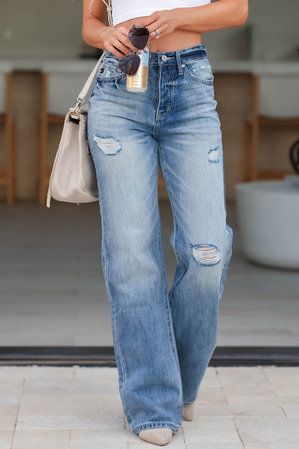 Light Blue High Rise Distressed Straight Leg Jeans

	


		Distressed detailing adds a trendy edge to these high rise jeans
	
	
		The straight leg silhouette creates a flattering and versatile fit, suitable foBottomsDalilly Designs BoutiqueLight Blue High Rise Distressed Straight Leg Jeans