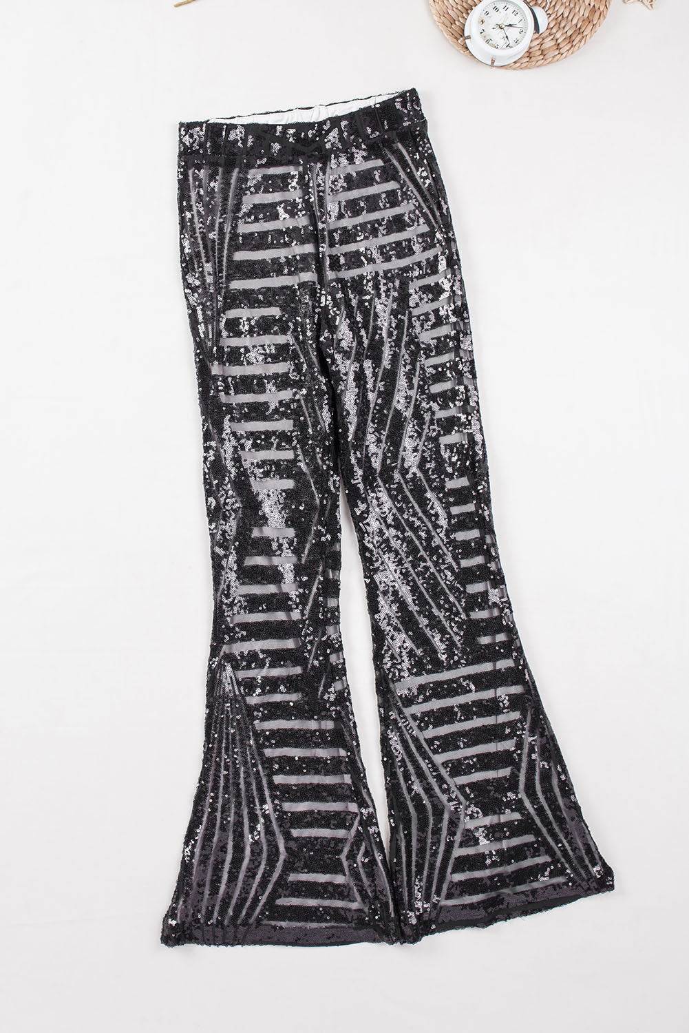 Black Sequin Wide Leg Pants

Insanely gorgeous sequins on mesh in an Art Deco pattern
Super flattering cut giving you legs for days fitting snugly to the knee with a wide flare
Stunning sequiBottomsDalilly Designs BoutiqueBlack Sequin Wide Leg Pants