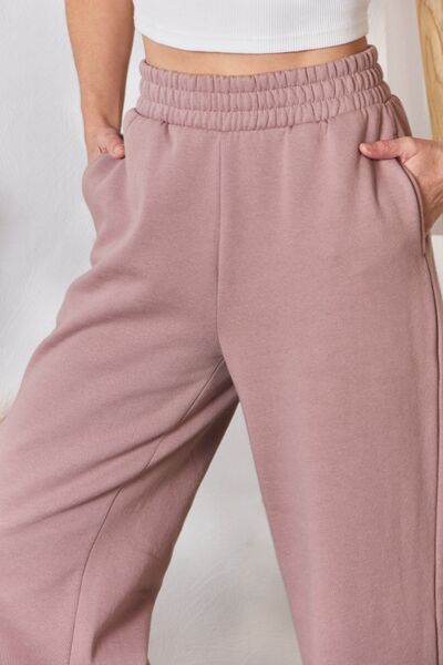 RISEN High Waist Slit Wide Leg pantsThese lounge pants offer unparalleled coziness, perfect for lounging at home or stepping out in relaxed elegance. The wide-leg silhouette ensures freedom of movementBottomsDalilly Designs BoutiqueRISEN High Waist Slit Wide Leg pants