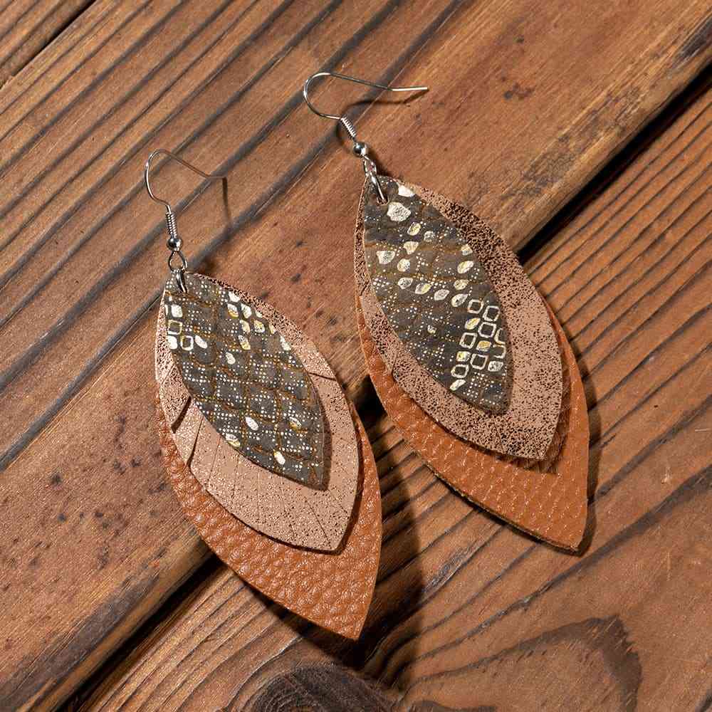 PU Leather Drop Earrings
Material: Alloy, PU
Care instructions: Avoid wearing during exercise, as sweat will react with the jewelry to produce silver chloride and copper sulfide, which causAccessoriesDalilly Designs BoutiquePU Leather Drop Earrings