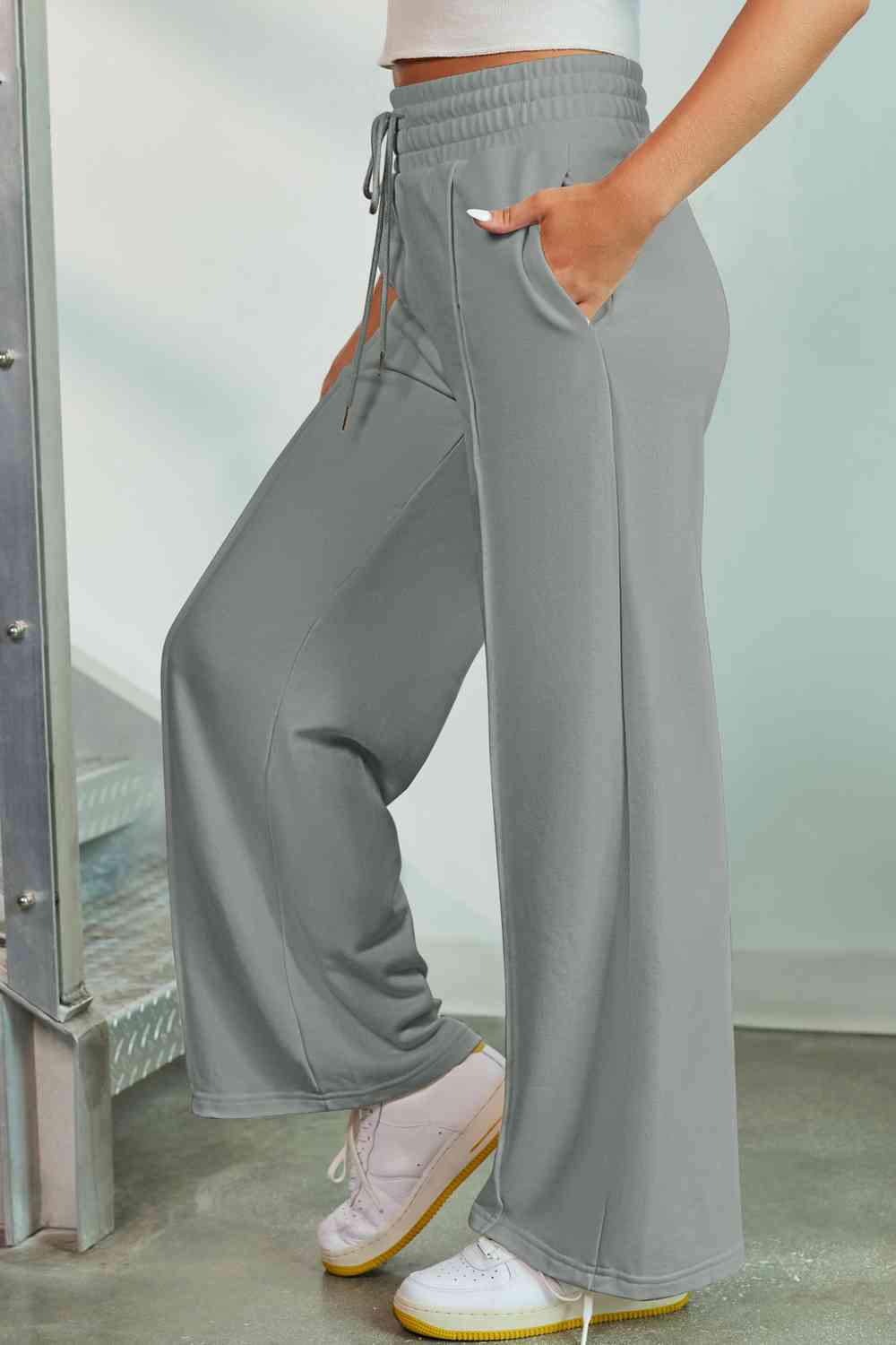 Drawstring Wide Leg Pants with Pockets
Features: Pocketed
Sheer: Opaque
Material composition: 50% polyester, 45% viscose, 5% elastane
Care instructions: Machine wash cold. Tumble dry low.
Imported
ProducDalilly Designs BoutiqueDrawstring Wide Leg Pants