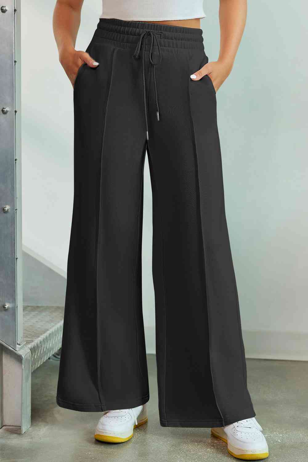 Drawstring Wide Leg Pants with Pockets
Features: Pocketed
Sheer: Opaque
Material composition: 50% polyester, 45% viscose, 5% elastane
Care instructions: Machine wash cold. Tumble dry low.
Imported
ProducDalilly Designs BoutiqueDrawstring Wide Leg Pants