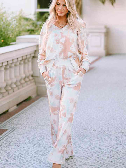 Printed Long Sleeve Top and Wide Leg Pants Lounge Set
Features: Pocketed
Number of pieces: Two-piece
Sheer: Opaque
Stretch: Slightly stretchy
Material composition: 95% polyester, 5% elastane
Care instructions: Machine Dalilly Designs BoutiqueWide Leg Pants Lounge Set