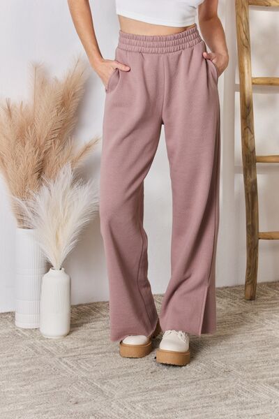 RISEN High Waist Slit Wide Leg pantsThese lounge pants offer unparalleled coziness, perfect for lounging at home or stepping out in relaxed elegance. The wide-leg silhouette ensures freedom of movementBottomsDalilly Designs BoutiqueRISEN High Waist Slit Wide Leg pants