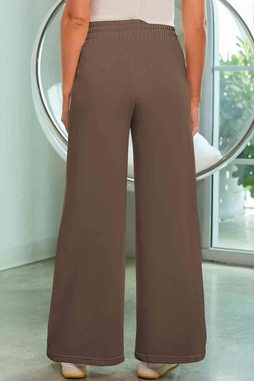 Drawstring Wide Leg Pants with Pockets
Features: Pocketed
Sheer: Opaque
Material composition: 50% polyester, 45% viscose, 5% elastane
Care instructions: Machine wash cold. Tumble dry low.
Imported
ProducDalilly Designs BoutiqueDrawstring Wide Leg Pants