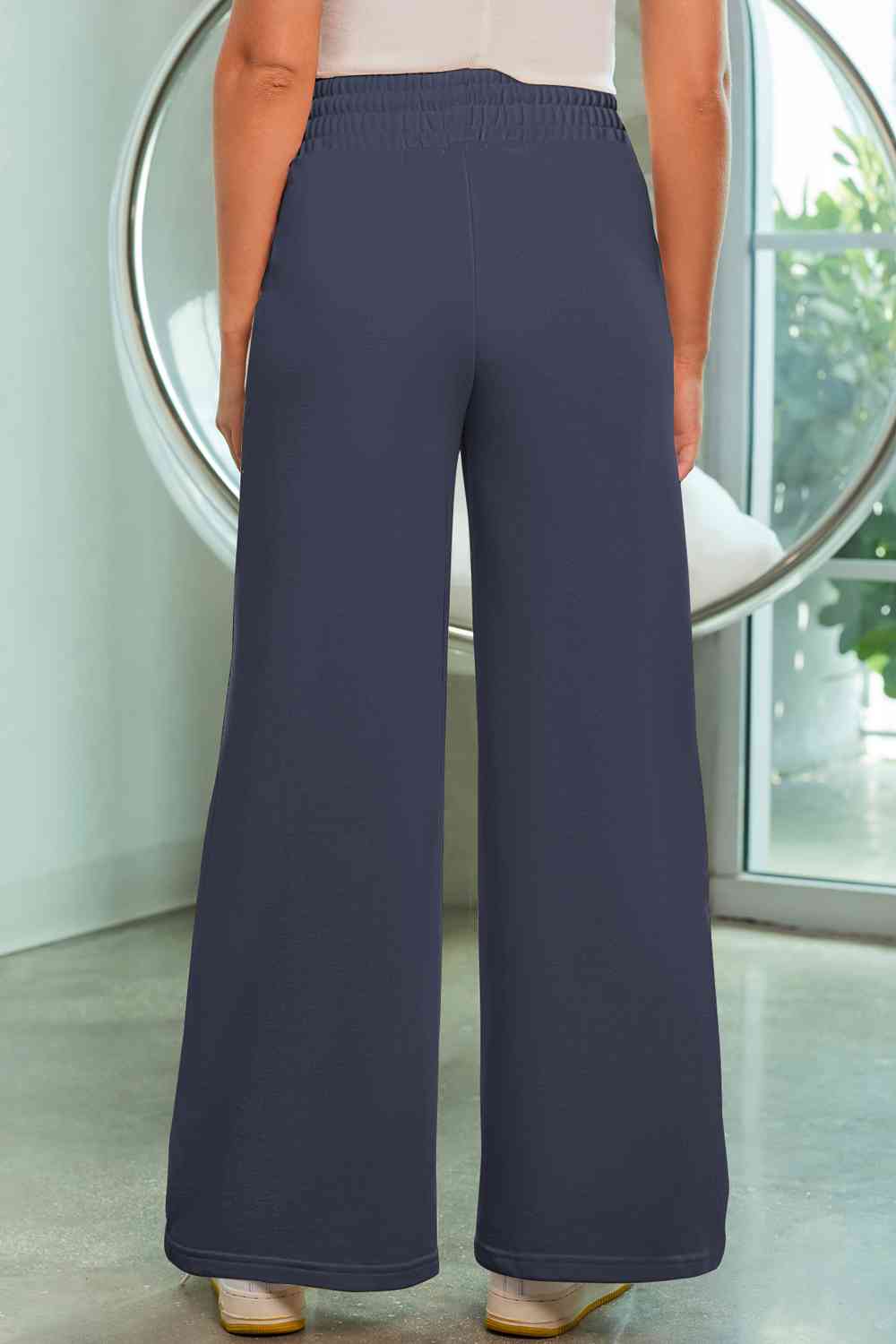 Drawstring Wide Leg Pants with Pockets
Features: Pocketed
Sheer: Opaque
Material composition: 50% polyester, 45% viscose, 5% elastane
Care instructions: Machine wash cold. Tumble dry low.
Imported
ProducDalilly Designs BoutiqueDrawstring Wide Leg Pants