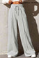 Drawstring Wide Leg Pants with Pockets
Features: Pocketed
Sheer: Opaque
Material composition: 50% polyester, 45% viscose, 5% elastane
Care instructions: Machine wash cold. Tumble dry low.
Imported
ProducDalilly Designs BoutiqueDrawstring Wide Leg Pants