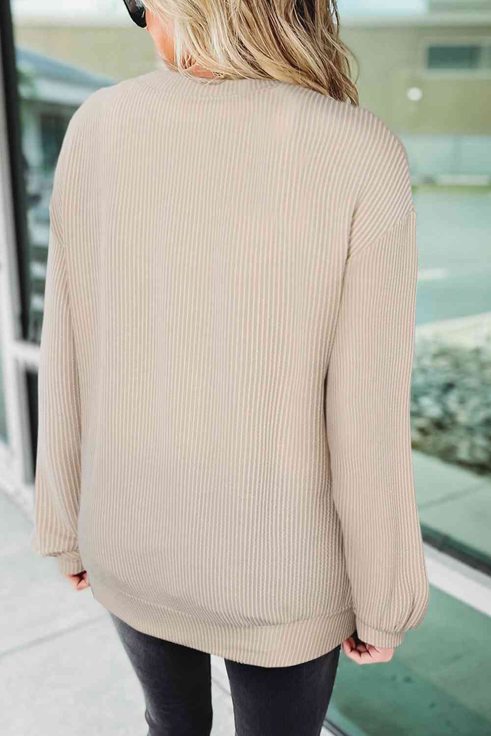 Ribbed Round Neck Long Sleeve Graphic Sweatshirt
Features: Basic style
Sheer: Opaque
Stretch: Slightly stretchy
Material composition: 75% polyester, 20% viscose, 5% elastane
Care instructions: Machine wash cold. TTopsDalilly Designs BoutiqueRibbed Round Neck Long Sleeve Graphic Sweatshirt