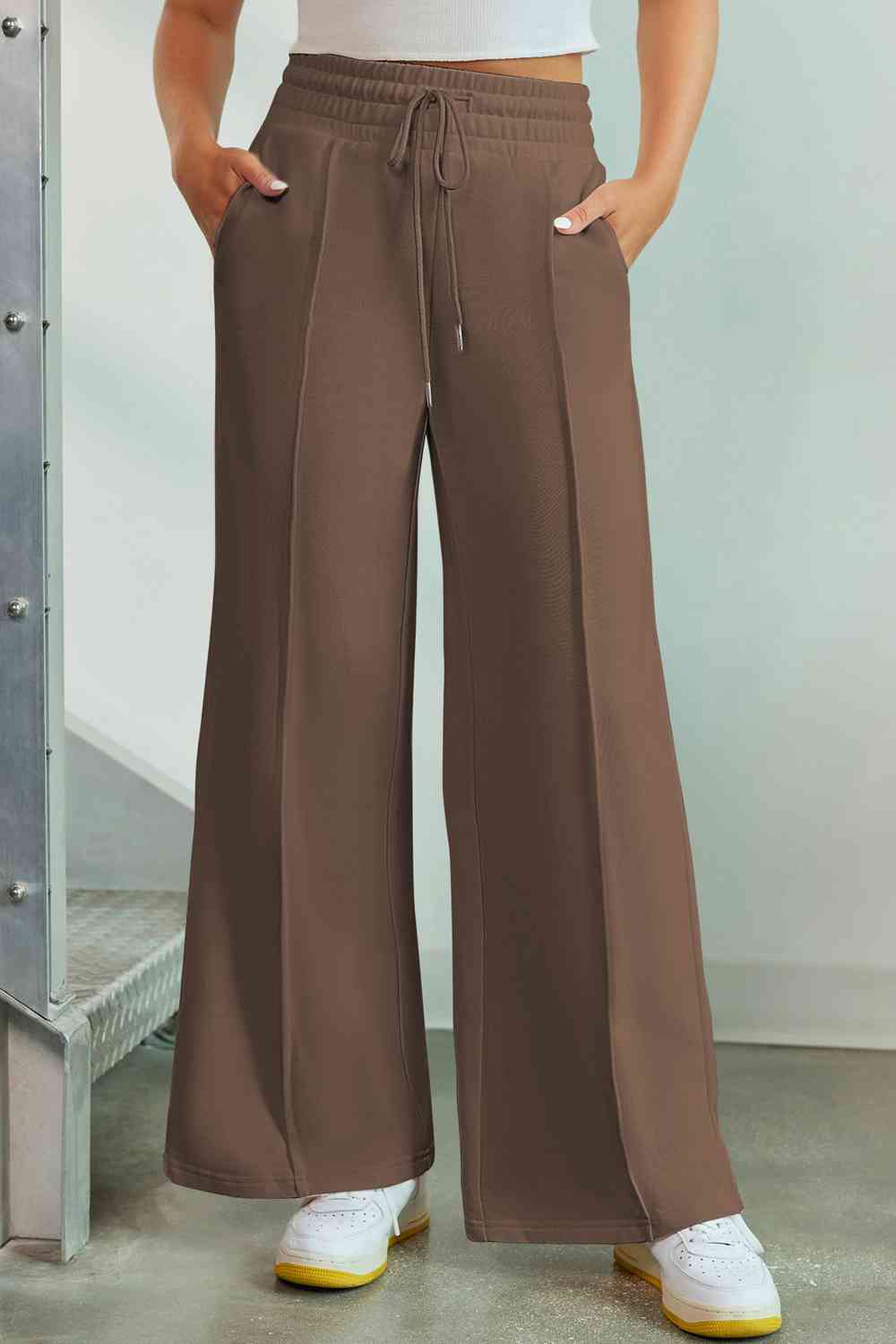 Drawstring Wide Leg Pants with Pockets
Features: Pocketed
Sheer: Opaque
Material composition: 50% polyester, 45% viscose, 5% elastane
Care instructions: Machine wash cold. Tumble dry low.
Imported
ProducDalilly Designs BoutiqueDrawstring Wide Leg Pants